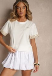 Biały Bawełniany T-shirt z Koronkowymi Zdobieniami i Cekinami Drane. Białe t-shirty Renee, l, z aplikacjami, z bawełny, eleganckie, bez kołnierzyka, bez ramiączek. W wyprzedaży za 47.99 zł.