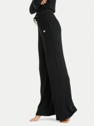 Roxy Spodnie dresowe Rise & Vibe New Rib ERJNP03673 Czarny Relaxed Fit. Czarne spodnie sportowe Roxy, bez wzorów, z dresówki. Za 279.99 zł.