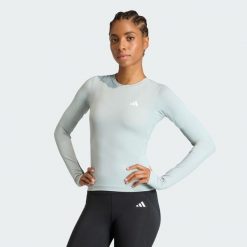 Bluzka z długim rękawem PrimeLift Essentials Workout Contour. Zielone bluzki adidas, bez wzorów, sportowe, bez kołnierzyka, bez ramiączek. Za 149.00 zł.