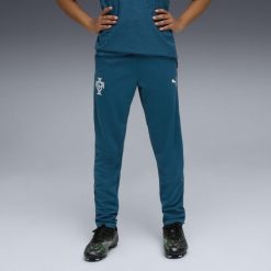Młodzieżowe spodnie treningowe Portugalia PUMA. Niebieskia spodnie dresowe Puma, bez wzorów. Za 279.00 zł.