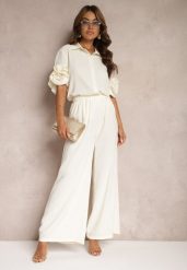 Beżowy Komplet Szerokie Spodnie i Koszula z Falbanami Rivathins. Brązowe koszule Renee, l, bez wzorów, eleganckie, bez kołnierzyka, bez ramiączek. W wyprzedaży za 175.99 zł.