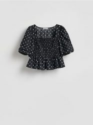 Bluzka z bufiastymi rękawami - czarny. Czarne bluzki Reserved, l, bez wzorów, z bawełny, bez kołnierzyka, bez ramiączek. Za 99.99 zł.