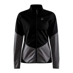 Damska wiatrówka Craft Glide. Czarne kurtki przejściowe sportowe Craft, bez wzorów, z softshellu, bez kaptura, na fitness i siłownię. W wyprzedaży za 261.25 zł.