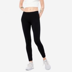 Legginsy fitness damskie Nyamba 100 Salto. Czarne legginsy DOMYOS, bez wzorów, z bawełny, sportowe, długie. Za 29.99 zł.