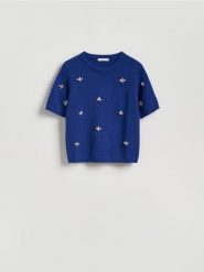 Sweter z błyszczącą aplikacją - niebieski. Niebieskie swetry Reserved, l, z aplikacjami, z dzianiny, bez ramiączek. Za 139.99 zł.