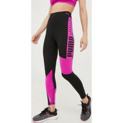 Puma legginsy treningowe Favorite damskie kolor czarny z nadrukiem. Czarne legginsy Puma, bez wzorów, ze skóry. W wyprzedaży za 179.99 zł.