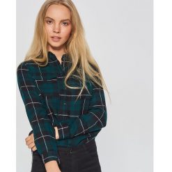 Koszula w kratę - Khaki. Koszule marki DOMYOS. W wyprzedaży za 29.99 zł.