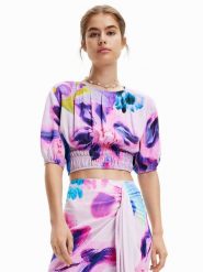 Desigual Bluzka MONSIEUR CHRISTIAN LACROIX Rina 23SWBW15 Fioletowy Regular Fit. Fioletowe bluzki Desigual, s, bez wzorów, z wiskozy, bez kołnierzyka, bez ramiączek. Za 129.99 zł.
