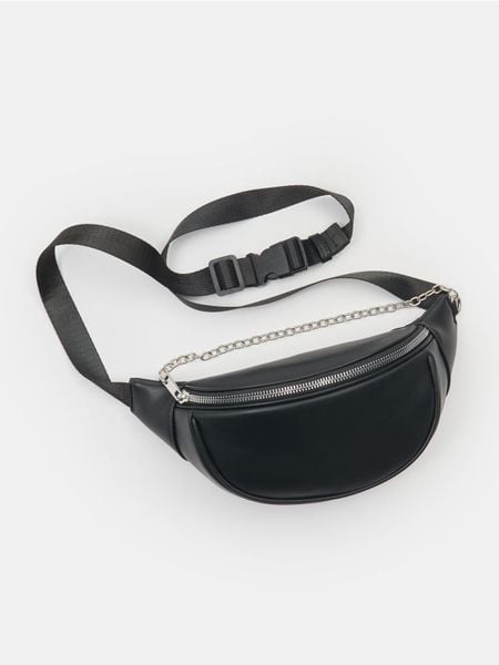 Saszetka nerka z imitacji skóry - czarny. Czarne nerki i saszetki Sinsay, bez wzorów, ze skóry, bez dodatków. W wyprzedaży za 17.99 zł.