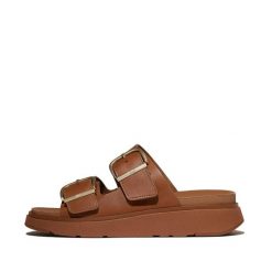 Damskie sandały na koturnie FitFlop Gen-FF. Brązowe sandały FIT FLOP, bez wzorów, ze skóry, eleganckie, bez obcasa, na koturnie, bez zapięcia. Za 678.50 zł.