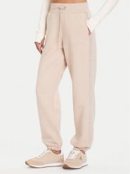 Guess Spodnie dresowe V5BB10 KB681 Beżowy Regular Fit. Brązowe spodnie dresowe Guess, z aplikacjami, z bawełny. Za 299.99 zł.