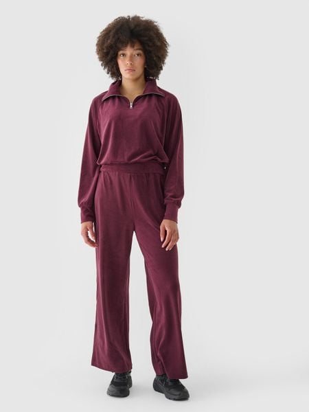 4F Spodnie dresowe z weluru z szerokimi nogawkami damskie - czerwone XL. Czerwone spodnie dresowe 4f, bez wzorów, z dresówki, sportowe. W wyprzedaży za 69.99 zł.
