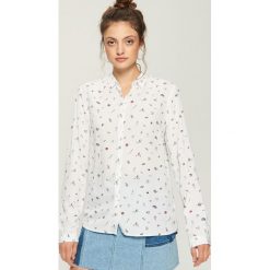 Wzorzysta koszula - Czerwony. Koszule marki QUECHUA. Za 39.99 zł.