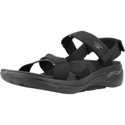 Sandały SKECHERS GO WALK ARCH FIT SANDAL Czarny. Czarne sandały Skechers, bez wzorów, z materiału, klasyczne, bez obcasa, bez zapięcia. Za 342.10 zł.