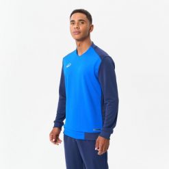 Bluza piłkarska dla dorosłych Kipsta T100. Niebieskie bluzy KIPSTA, s, bez wzorów, z elastanu, eleganckie, bez ramiączek, bez kaptura. Za 69.99 zł.