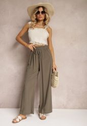 Ciemnozielone Spodnie z Bawełny High Waist z Szerokimi Nogawkami i Gumką w Pasie Clisea. Zielone jeansy Renee, na lato, l, bez wzorów, z bawełny, z podwyższonym stanem. W wyprzedaży za 31.99 zł.