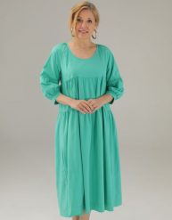 Luźna sukienka z bawełny. Zielone sukienki Unisono, s, bez wzorów, z bawełny, bez kołnierzyka, bez ramiączek, rozkloszowane. Za 239.00 zł.
