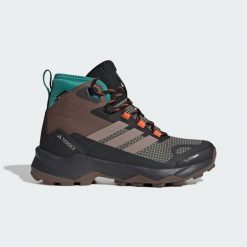 Buty trekkingowe Terrex Skychaser AX5 Mid GORE-TEX CLIMAWARM+. Brązowe trekkingi adidas, bez wzorów, z gore-texu, bez zapięcia, wspinaczkowe, climawarm (adidas). Za 666.30 zł.