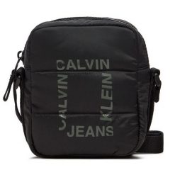 Saszetka Calvin Klein Jeans. Czarne nerki i saszetki Calvin Klein Jeans, bez wzorów, z jeansu, młodzieżowe, bez dodatków. Za 159.99 zł.