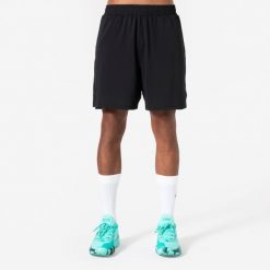 Spodenki do koszykówki unisex 500 z kieszeniami. Czarne szorty KIPSTA, bez wzorów, z materiału, sportowe. Za 44.99 zł.