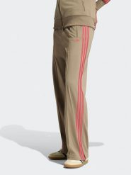 Adidas Spodnie dresowe w kolorze beżowym rozmiar: XL. Brązowe spodnie dresowe adidas, bez wzorów, z dresówki. Za 204.95 zł.