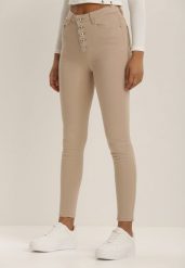 Beżowe Spodnie Skinny Winvienne. Brązowe jeansy Renee, s, w ażurowe wzory, z jeansu, z podwyższonym stanem, długie. W wyprzedaży za 55.99 zł.