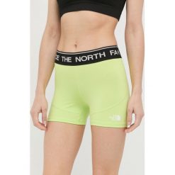 The North Face szorty sportowe damskie kolor zielony z nadrukiem medium waist. Zielone szorty sportowe The North Face, bez wzorów, ze skóry. W wyprzedaży za 84.99 zł.
