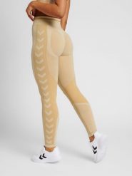 Legginsy damskie Hummel MT Lulu. Brązowe legginsy Hummel, bez wzorów, z dzianiny, klasyczne. Za 177.05 zł.