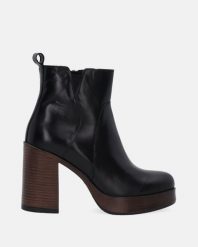 SKÓRZANE BOTKI NA SZEROKIM OBCASIE 2485996 SIE NERO. Botki Venezia, bez wzorów, ze skóry, bez obcasa, bez zapięcia. Za 479.00 zł.