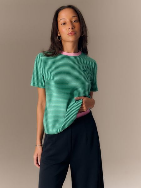 4F T-shirt regular damski - zielony M. Zielone t-shirty 4f, m, bez wzorów, z materiału, eleganckie, bez kołnierzyka, bez ramiączek. Za 69.99 zł.