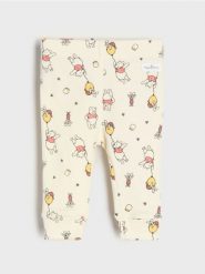 Bawełniane legginsy ze wzorem Winnie the Pooh - beżowy. Brązowe legginsy sportowe Sinsay, l, bez wzorów, z bawełny. Za 12.99 zł.
