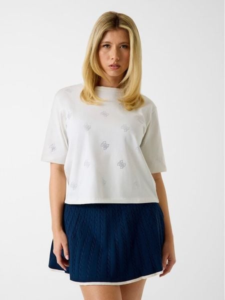 Guess T-Shirt V6GI18 K2985 Kremowy Regular Fit. Białe t-shirty Guess, xs, z aplikacjami, z bawełny, bez kołnierzyka, bez ramiączek. Za 164.99 zł.