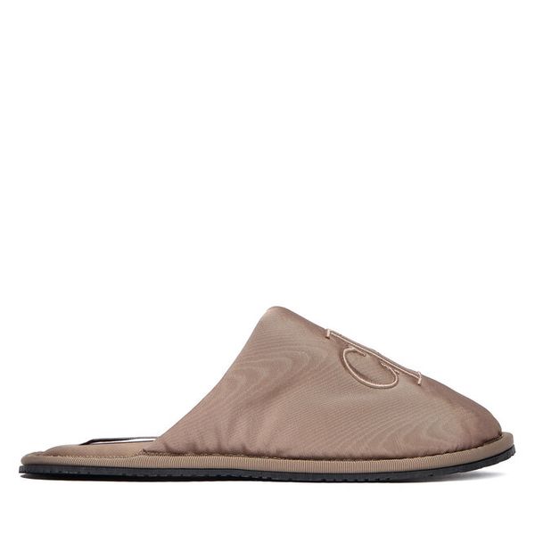 Kapcie Calvin Klein Jeans. Brązowe kapcie Calvin Klein Jeans, bez wzorów, z jeansu. Za 209.99 zł.