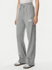 Adidas Spodnie dresowe Essentials IA4439 Szary jasny Loose Fit. Szare spodnie dresowe adidas, bez wzorów, z dresówki. Za 299.99 zł.