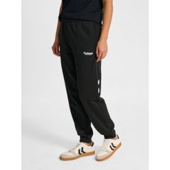 Damskie spodnie dresowe Hummel Legacy 2.0. Czarne spodnie dresowe Hummel, bez wzorów, z dresówki. Za 269.50 zł.
