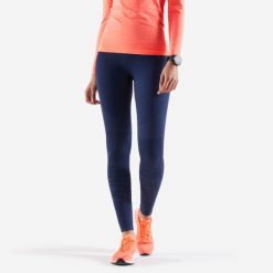 Legginsy do biegania damskie Kiprun Care. Niebieskie legginsy KIPRUN, bez wzorów, z materiału, długie. Za 89.99 zł.