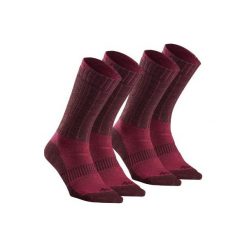 Skarpety turystyczne SH500 ultra-warm mid. Czerwone skarpetki QUECHUA, bez wzorów, z elastanu. Za 49.99 zł.