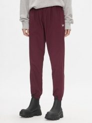 Reebok Spodnie dresowe Classics Franchise IL4627 Bordowy Relaxed Fit. Czerwone spodnie dresowe Reebok, bez wzorów, z dresówki. Za 159.99 zł.