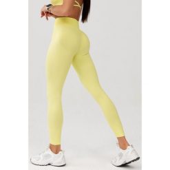Damskie legginsy bezszwowe Rough Radical Seamless Glow Long. Żółte legginsy ROUGH RADICAL, bez wzorów. W wyprzedaży za 127.92 zł.