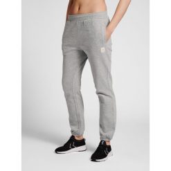 Damskie spodnie dresowe Hummel GG 12. Szare spodnie dresowe Hummel, bez wzorów, z dresówki. W wyprzedaży za 149.50 zł.