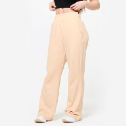 Spodnie dresowe damskie Domyos trening siłowy. Brązowe spodnie sportowe DOMYOS, bez wzorów, z bawełny, na fitness i siłownię. Za 129.99 zł.