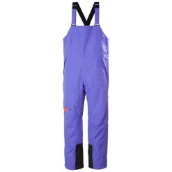 Damski kombinezon narciarski Helly Hansen Emiko Shell Bib. Fioletowe kombinezony Helly Hansen, bez wzorów, sportowe, bez kołnierzyka, bez ramiączek. Za 1,065.00 zł.