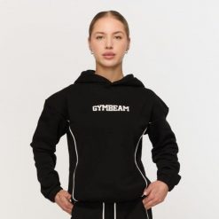 Bluza damska fitness z kapturem czarna Varsity. Czarne bluzy z kapturem GYMBEAM, m, bez wzorów, z bawełny, z kapturem, na fitness i siłownię. Za 139.90 zł.
