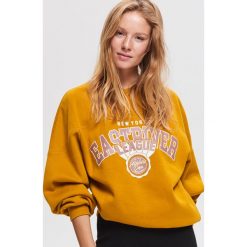 Sportowa bluza z dzianiny - Żółty. Bluzy bez kaptura marki KALENJI. Za 79.99 zł.