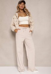 Beżowe Bawełniane Spodnie o Szerokim Kroju High Waist z Lampasami Pillorra. Brązowe jeansy Renee, bez wzorów, z bawełny, sportowe, z podwyższonym stanem. W wyprzedaży za 99.99 zł.