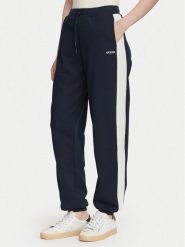 Guess Spodnie dresowe V6YB09 K4292 Granatowy Regular Fit. Niebieskie spodnie dresowe Guess, z aplikacjami, z bawełny. Za 394.99 zł.