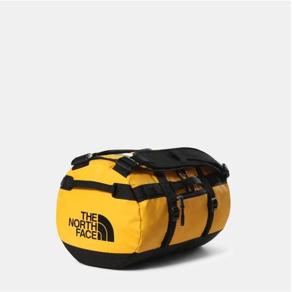Torba Base Camp XS Żółty - NF0A52SS4WP. Żółte torby podróżne The North Face, bez wzorów, z materiału. W wyprzedaży za 480.65 zł.