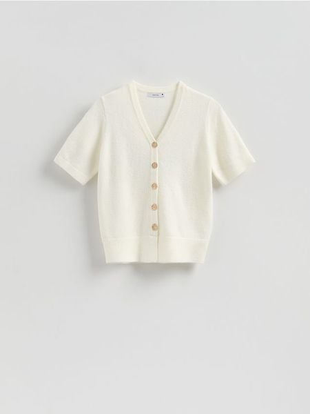 Kardigan z dekoracyjnymi guzikami - złamana biel. Swetry Reserved, l, bez wzorów, z dzianiny, bez ramiączek. Za 129.99 zł.
