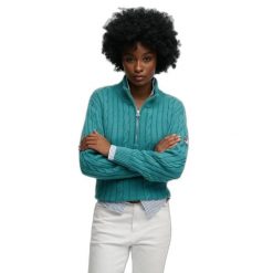 Damski pół-zamek sweter z warkoczowym splotem Superdry. Niebieskie swetry Superdry, na zimę, bez wzorów, ze splotem, bez ramiączek. Za 346.55 zł.