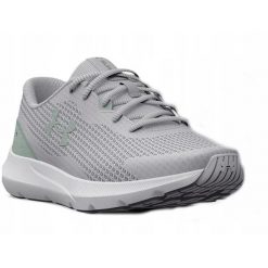 Buty biegowe damskie Under Armour W Surge 3. Szare buty do biegania Under Armour, bez wzorów, bez zapięcia, do biegania. Za 159.99 zł.